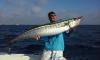 Mick with a monster wahoo caught with New Lattitude Sportfishing.jpg